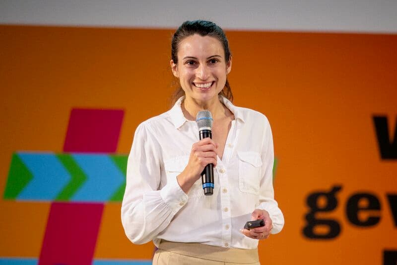 Brooke Gazdag delivering a keynote on stage
